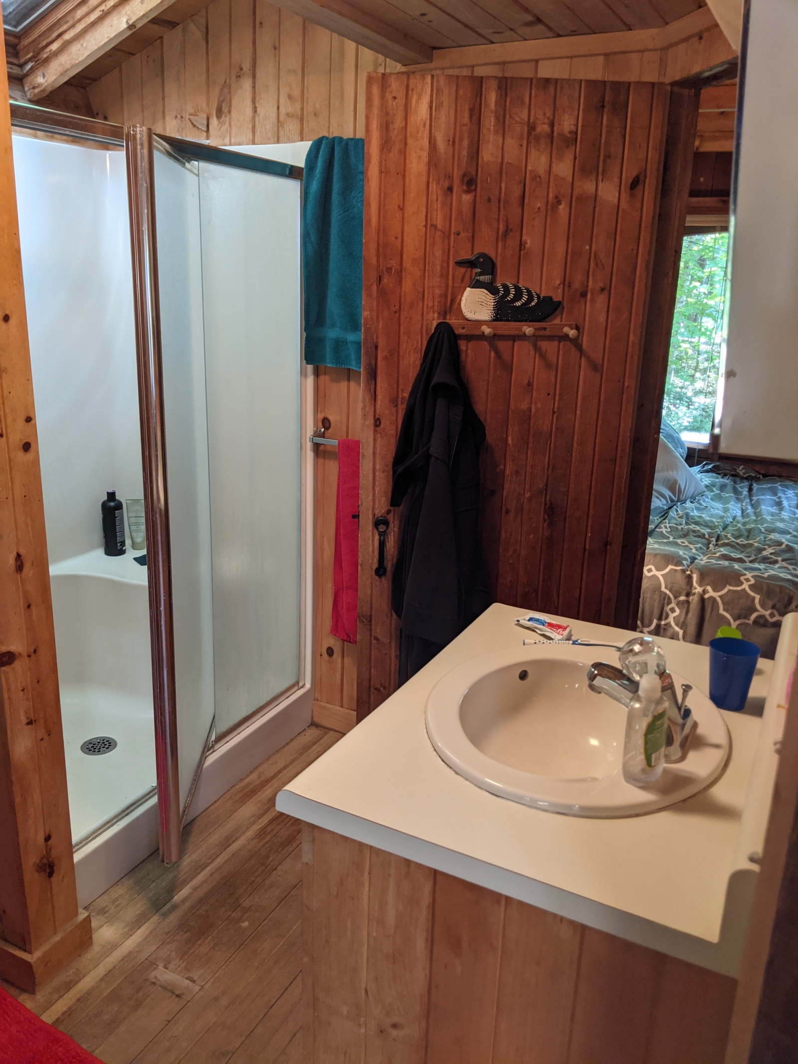 Family cabin at former sleepaway camp with docks, kayaks, and field