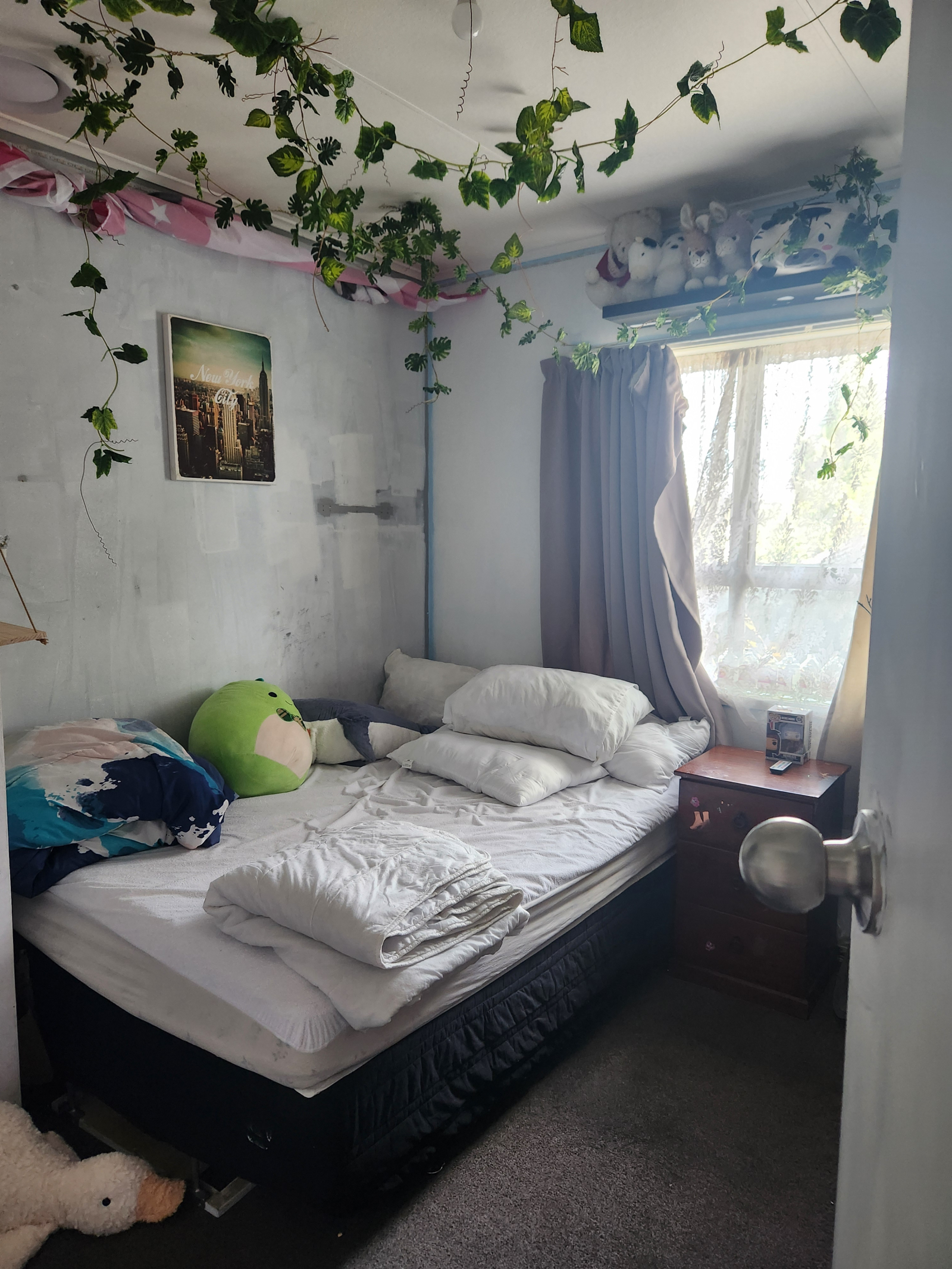 The teenagers room is in a constant state of change, but has a double bed.