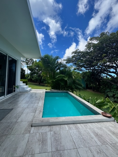 Modern, tiny home with plunge pool in lush garden