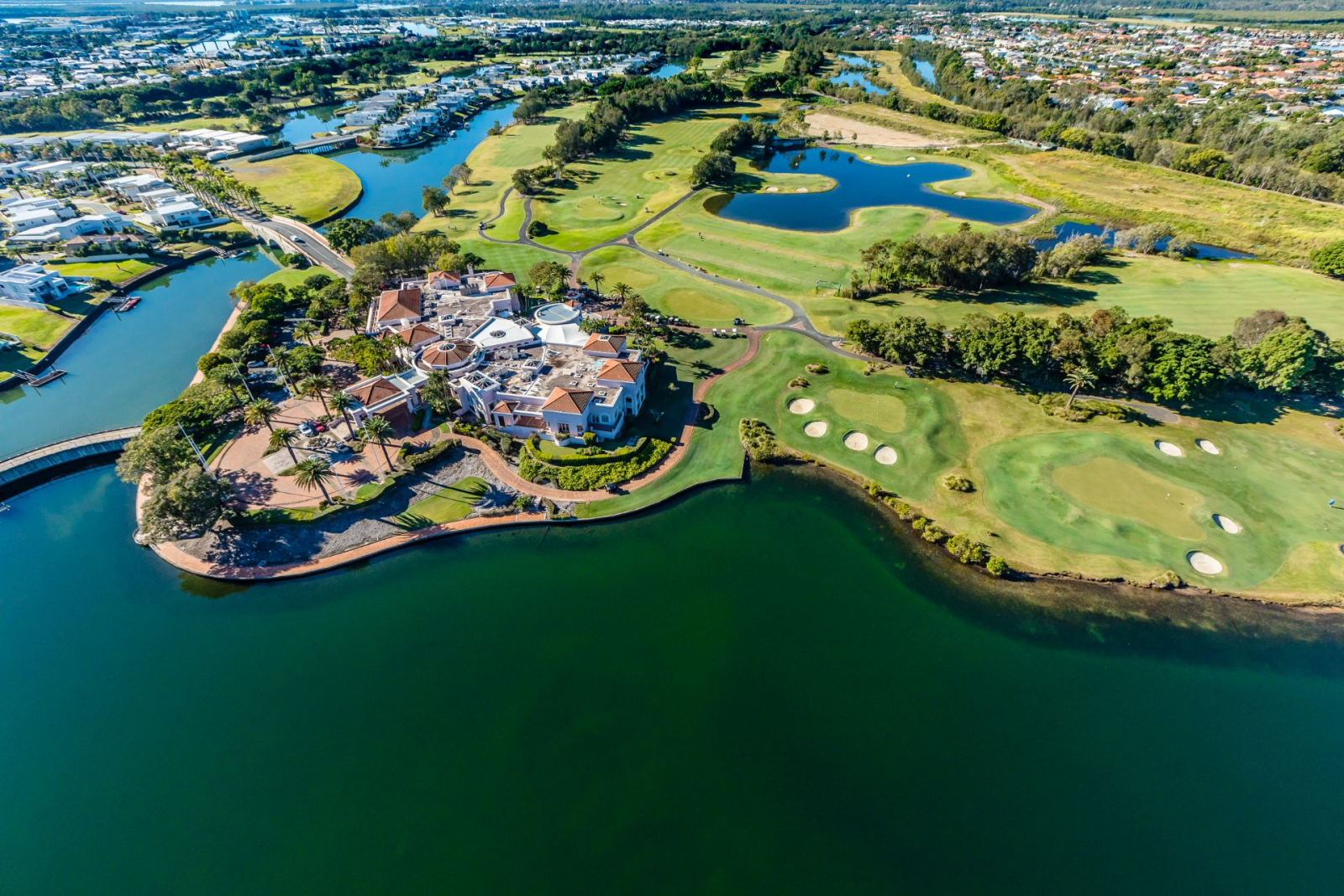 Modern waterfront home in a secure golfing estate.