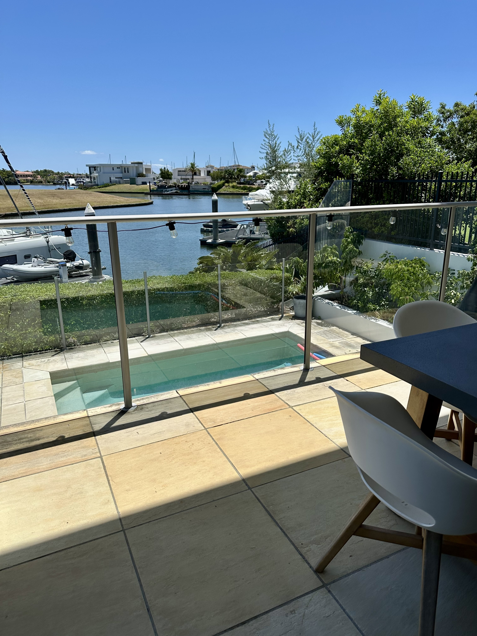 Modern waterfront home in a secure golfing estate.