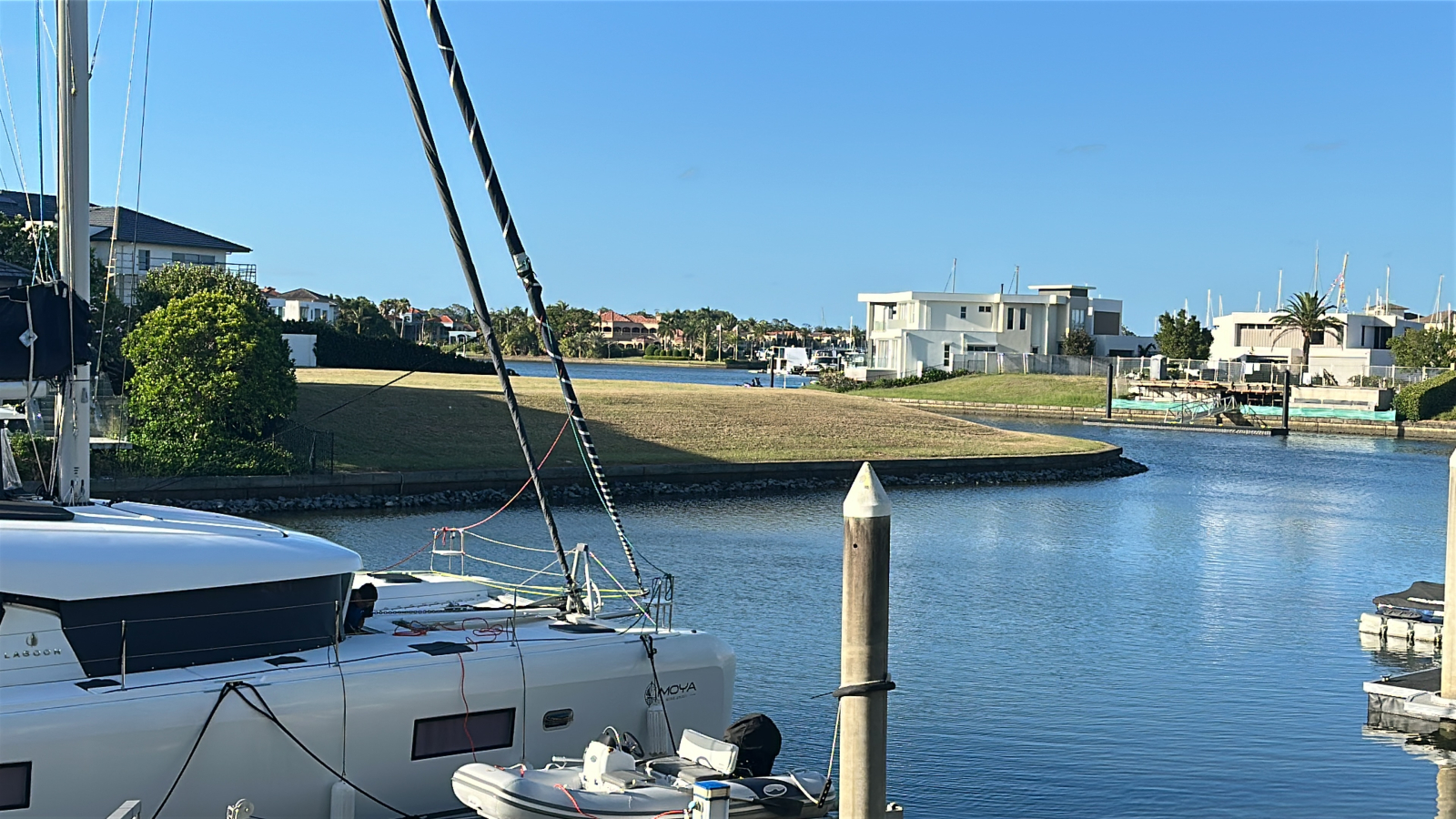 Modern waterfront home in a secure golfing estate.