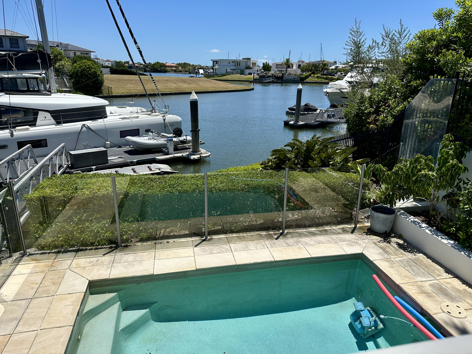 Modern waterfront home in a secure golfing estate.