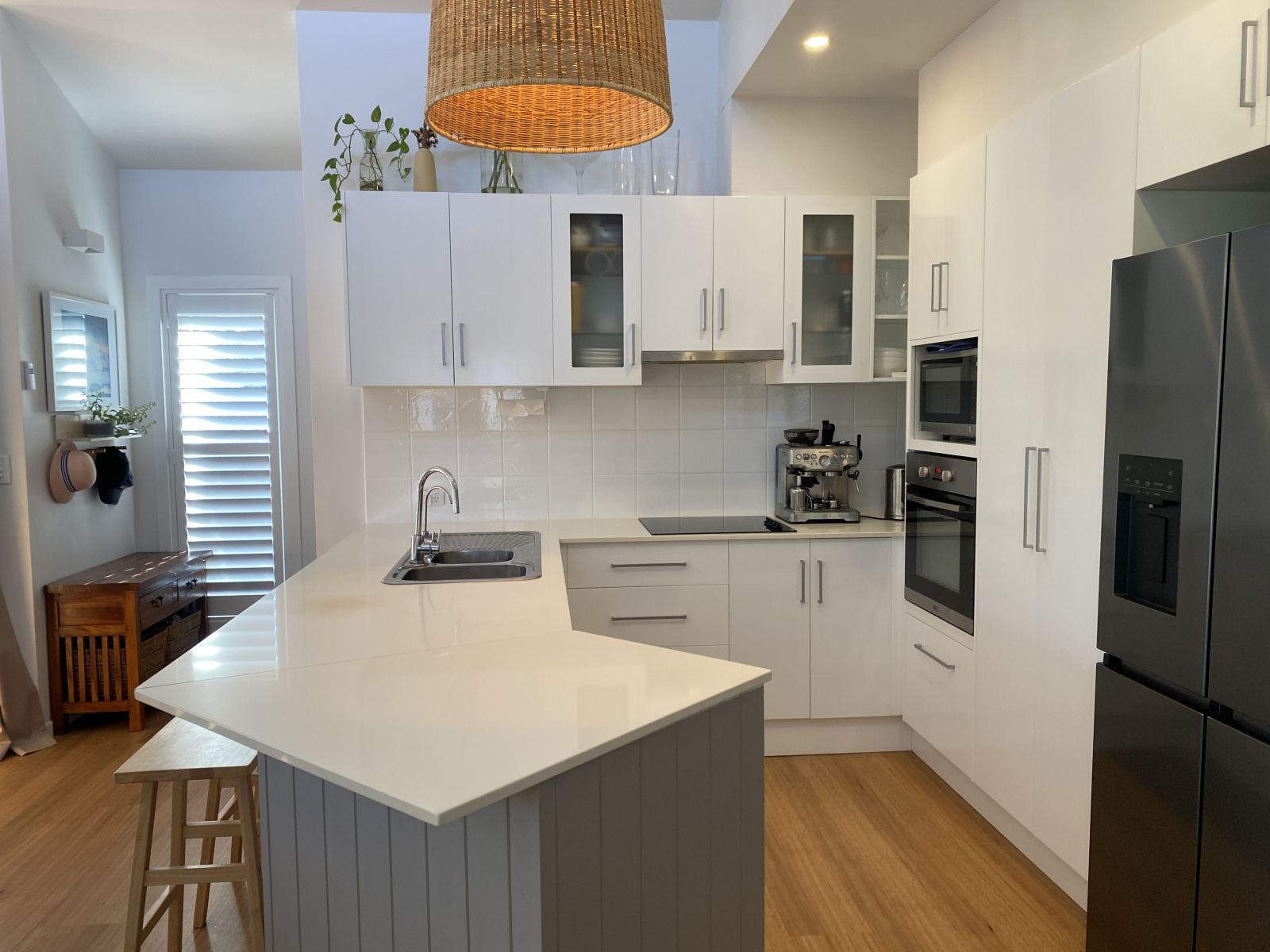 Kitchen with modern fridge and automatic ice maker