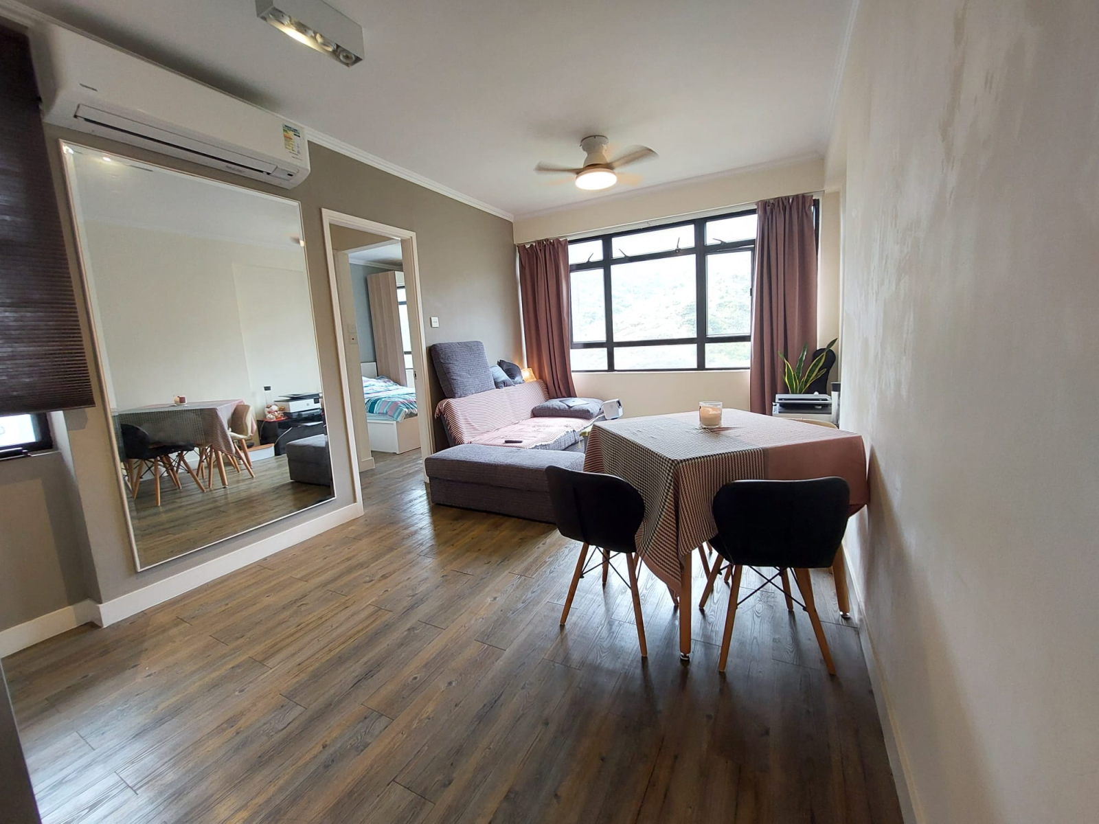 Bright, tidy, and comfortable living room with open views.