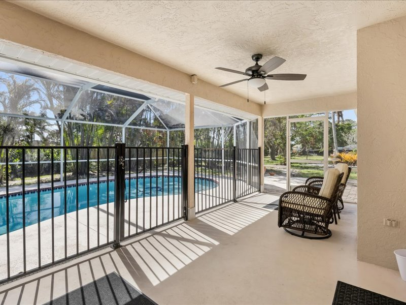 Heated pool house with garden yard on the canal