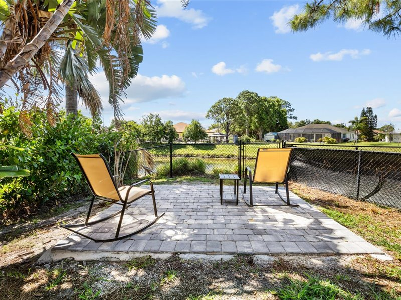 Heated pool house with garden yard on the canal