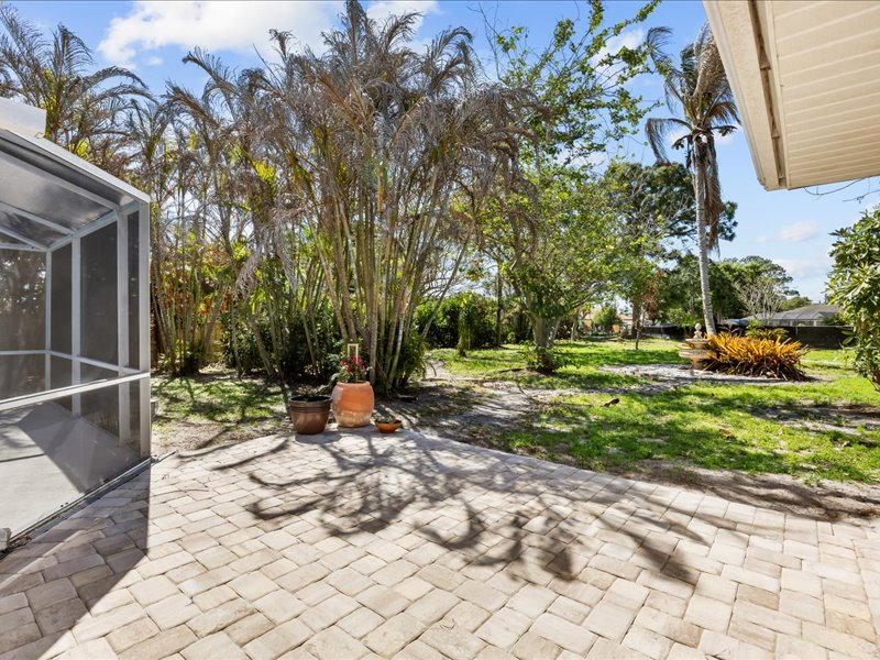 Heated pool house with garden yard on the canal