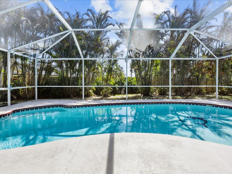 Heated pool house with garden yard on the canal