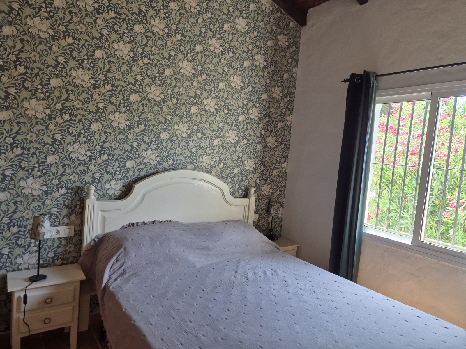Main bedroom with queen sized bed and bult-in closets.