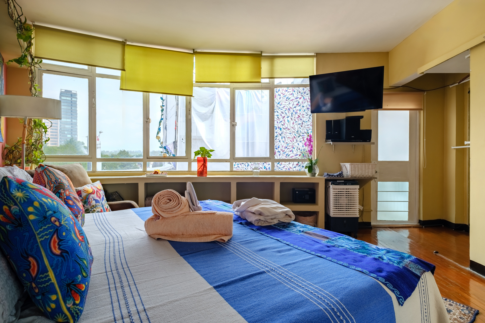 INCREDIBLE CITY VIEW, Relax in our King Size oasis with private bathroom  and terrace access. Comes equipped with a compact closet and custom shelving so you can unpack your folded clothes and feel right at home.