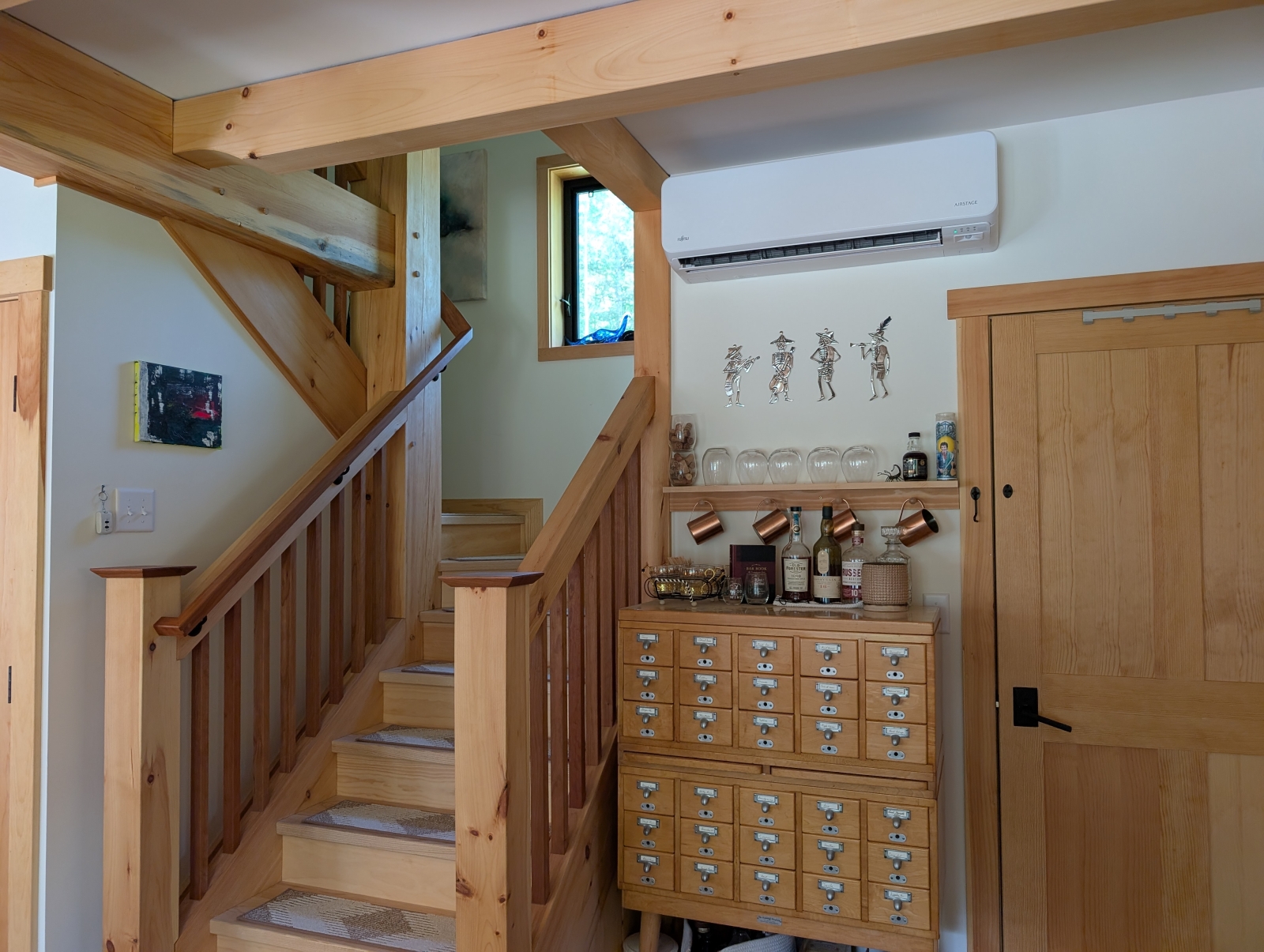 Staircase and card catalog turned bar