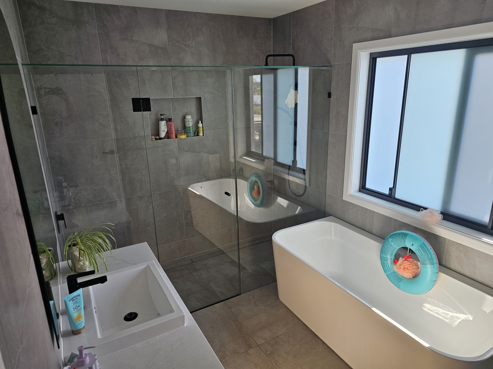 Modern family home walking distance to one of the Sunshine Coasts best family friendly beaches.