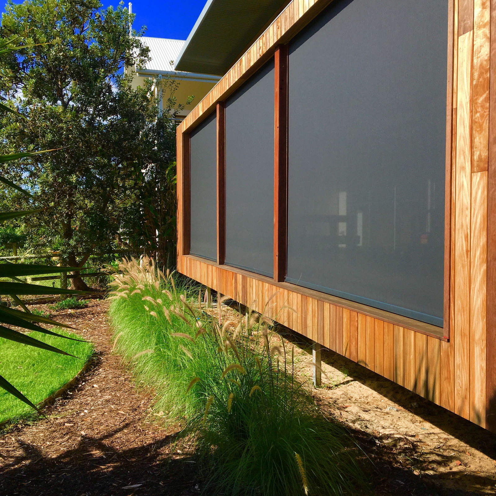 Back deck facing beach, with blinds down.