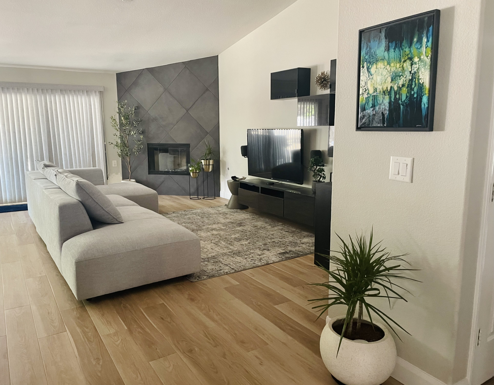 First living space - our cozy and casual TV room with 55” tv screen with auxiliary speakers.