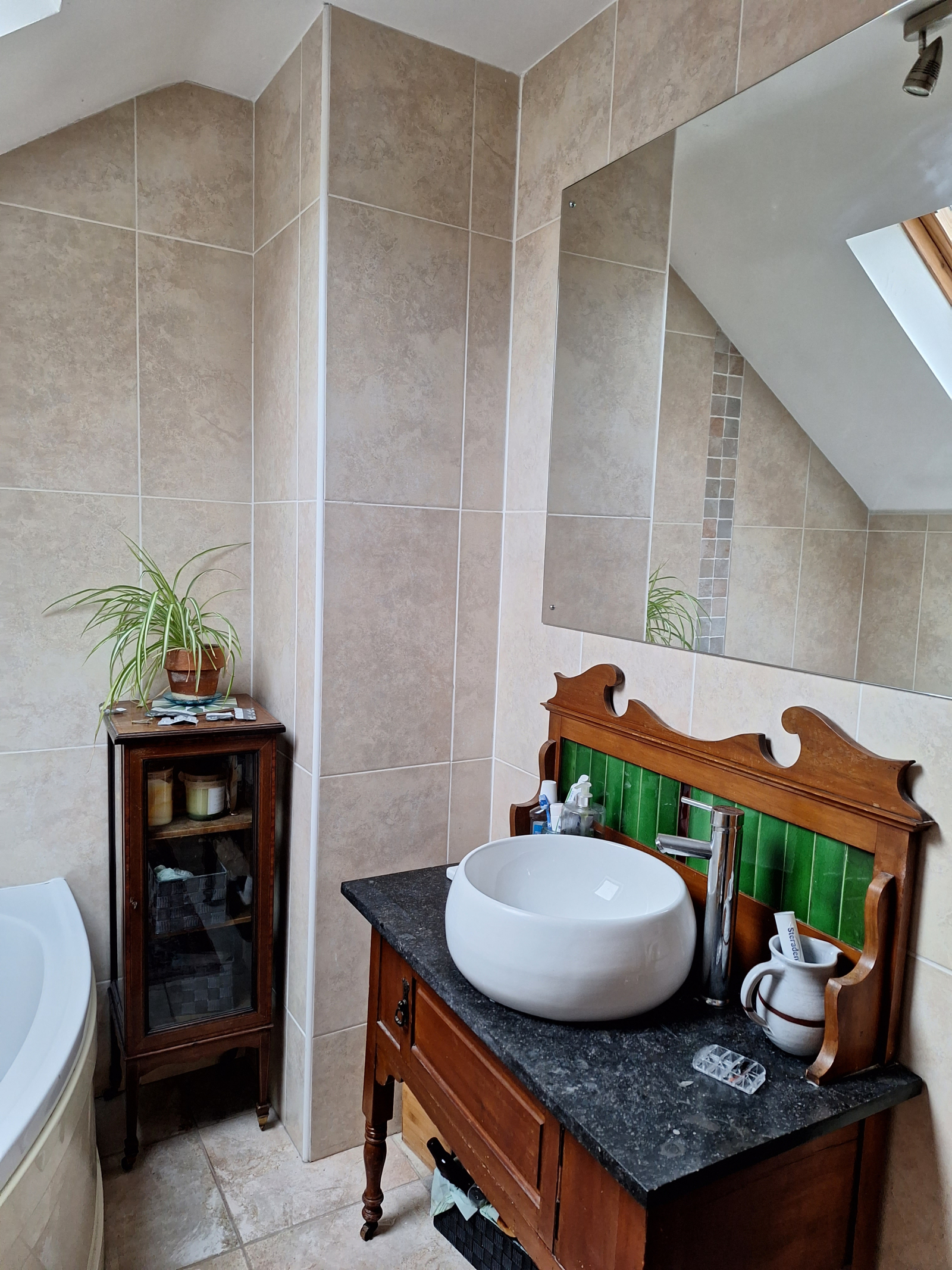 The main bathroom has a bath and a separate shower