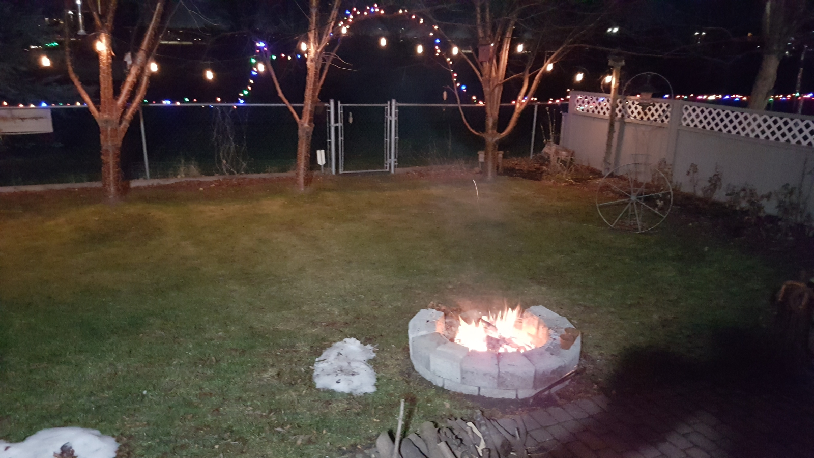 Evening fire with patio lights.
