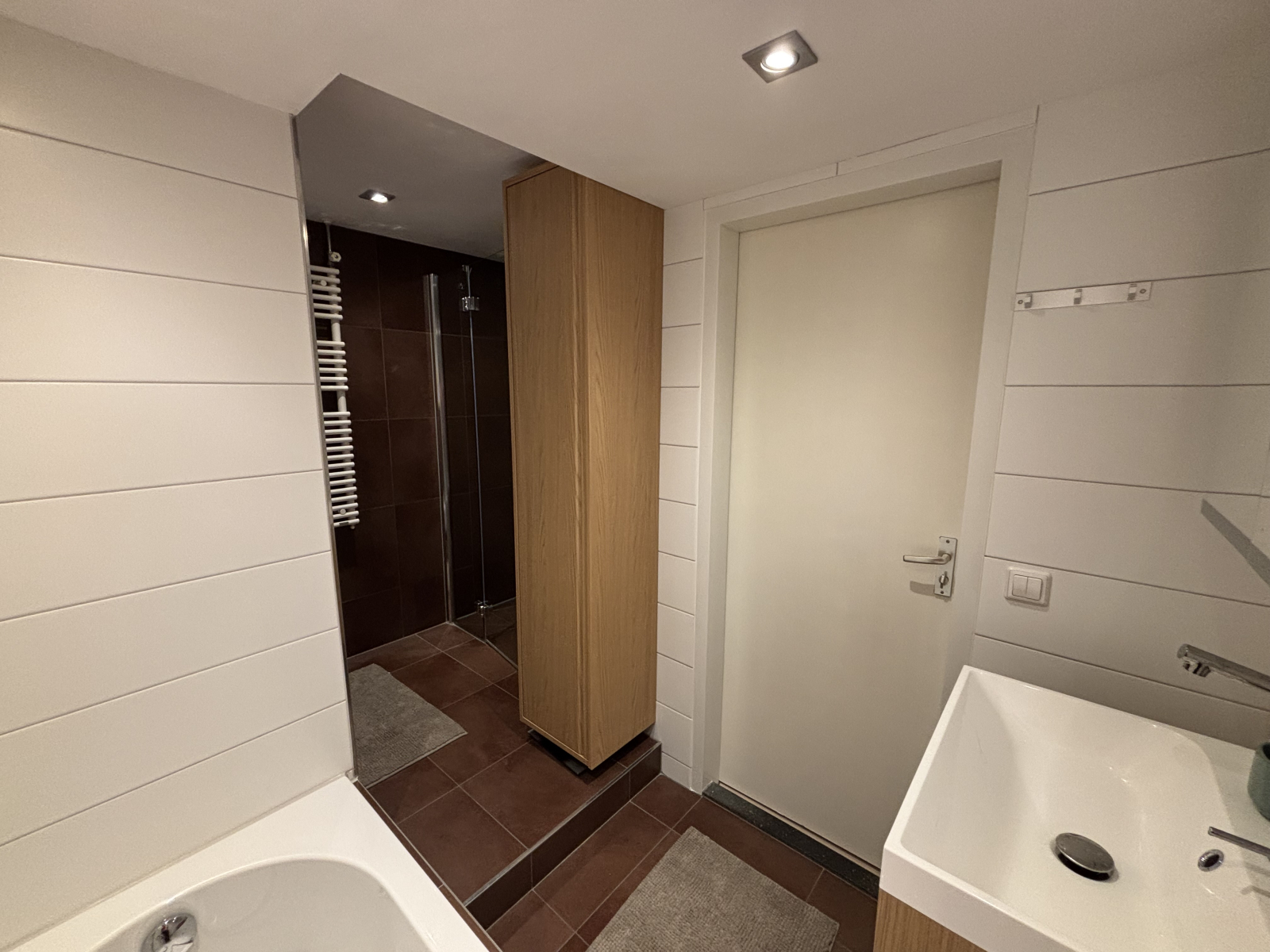 Bathroom with whirlpool bath, shower, toilet and sink