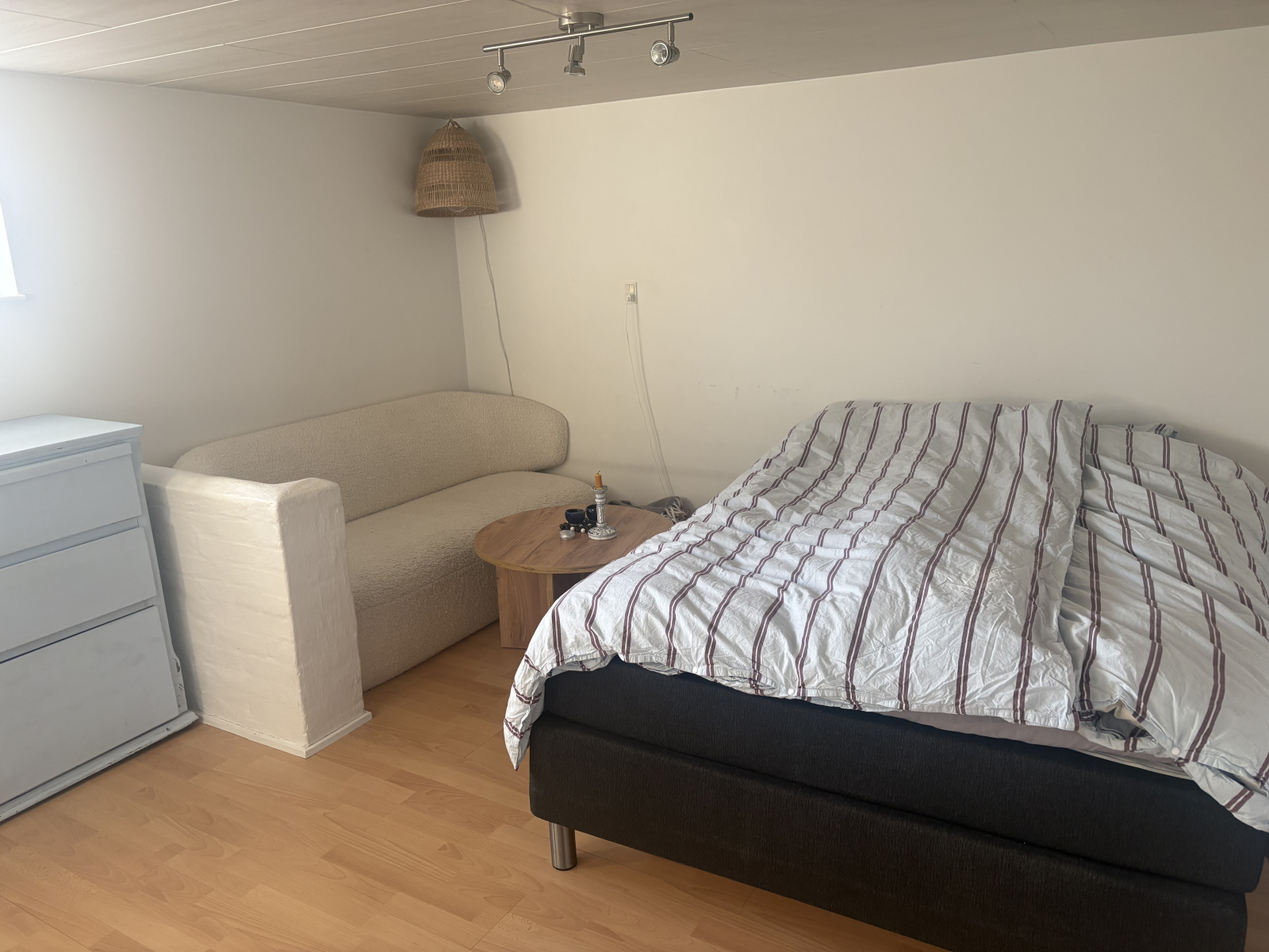 Basement: room 1 with queen size bed, sleeps up to 4. Window facing the garden.