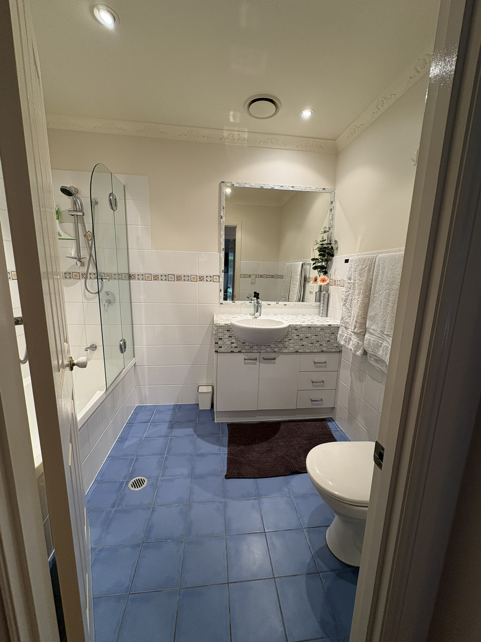 Main Bathroom with bath and Shower over bath