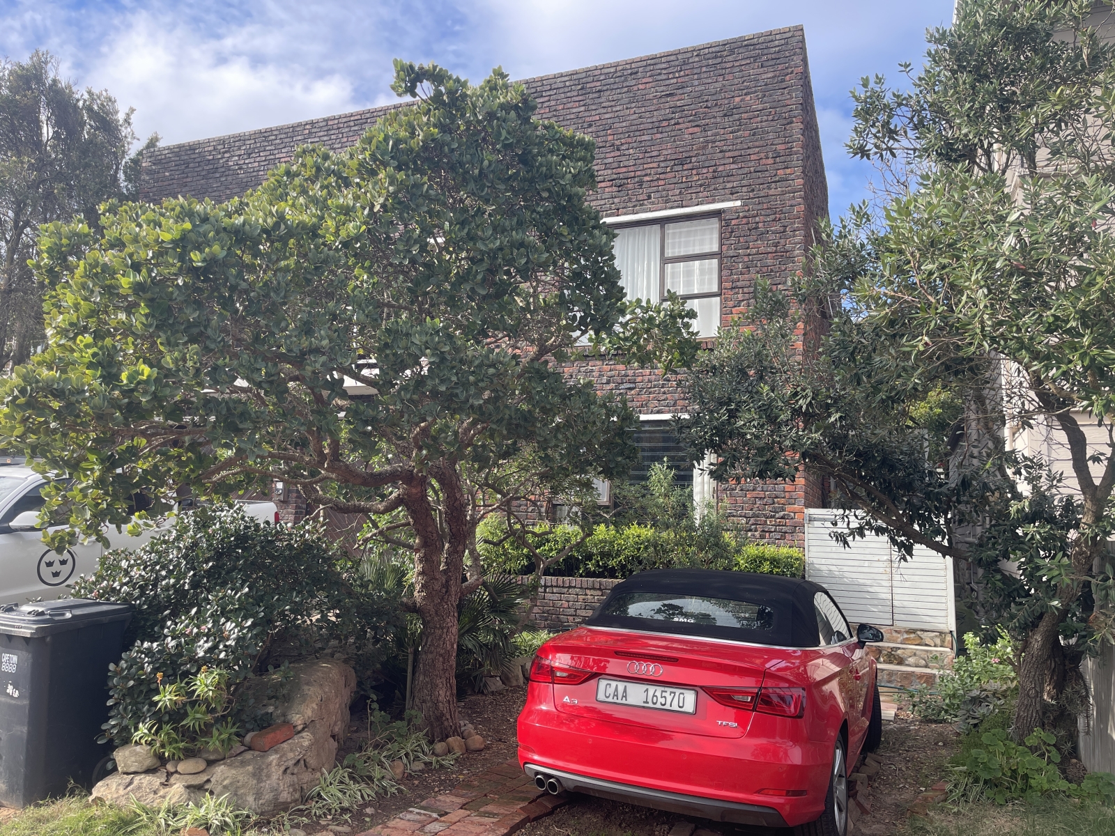 Private parking under the shade of the milkwood tree.