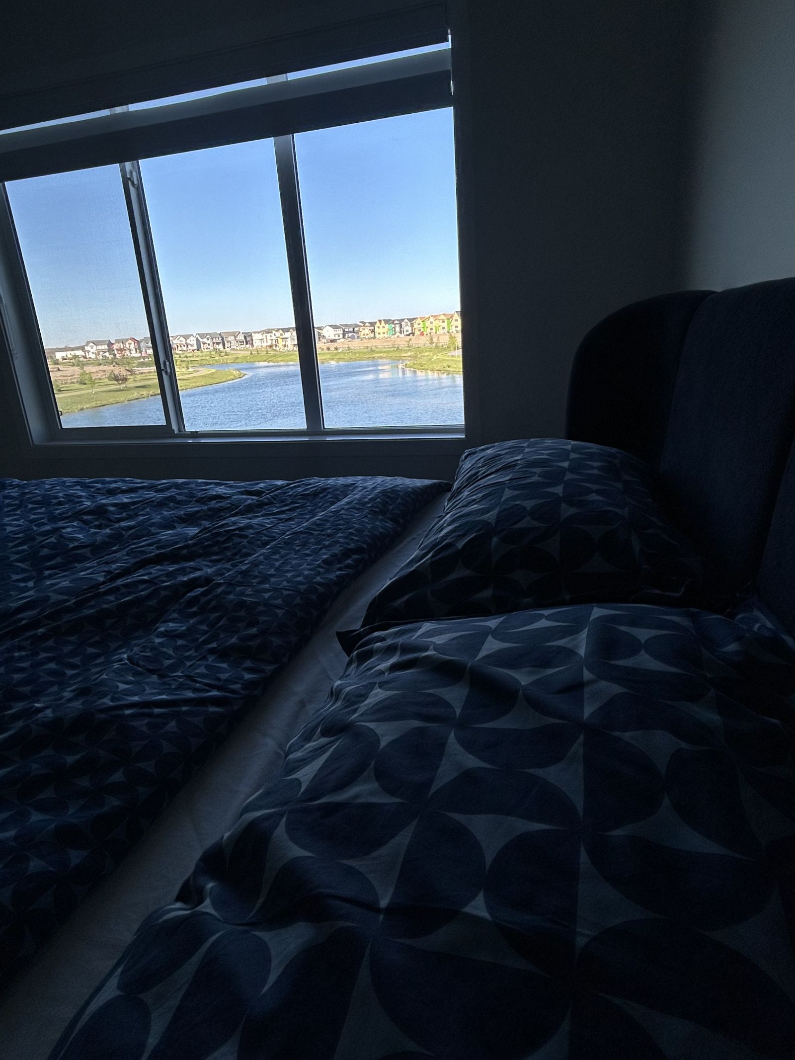 Master bedroom with stunning pond views and a king-size Tempur-Pedic mattress for ultimate comfort