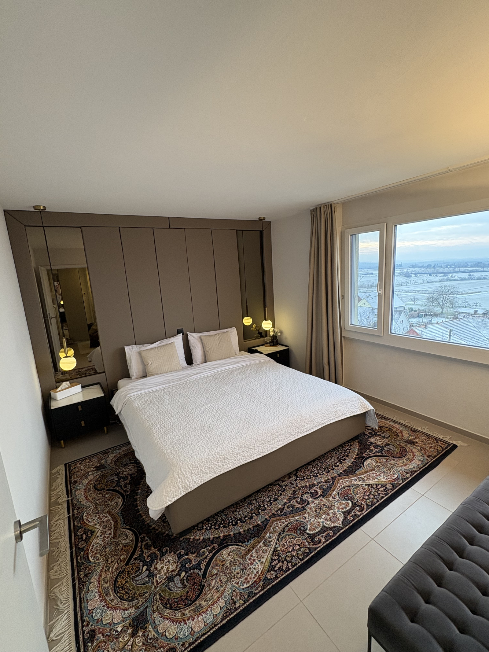 Wake up to the views from the cosy primary bedroom