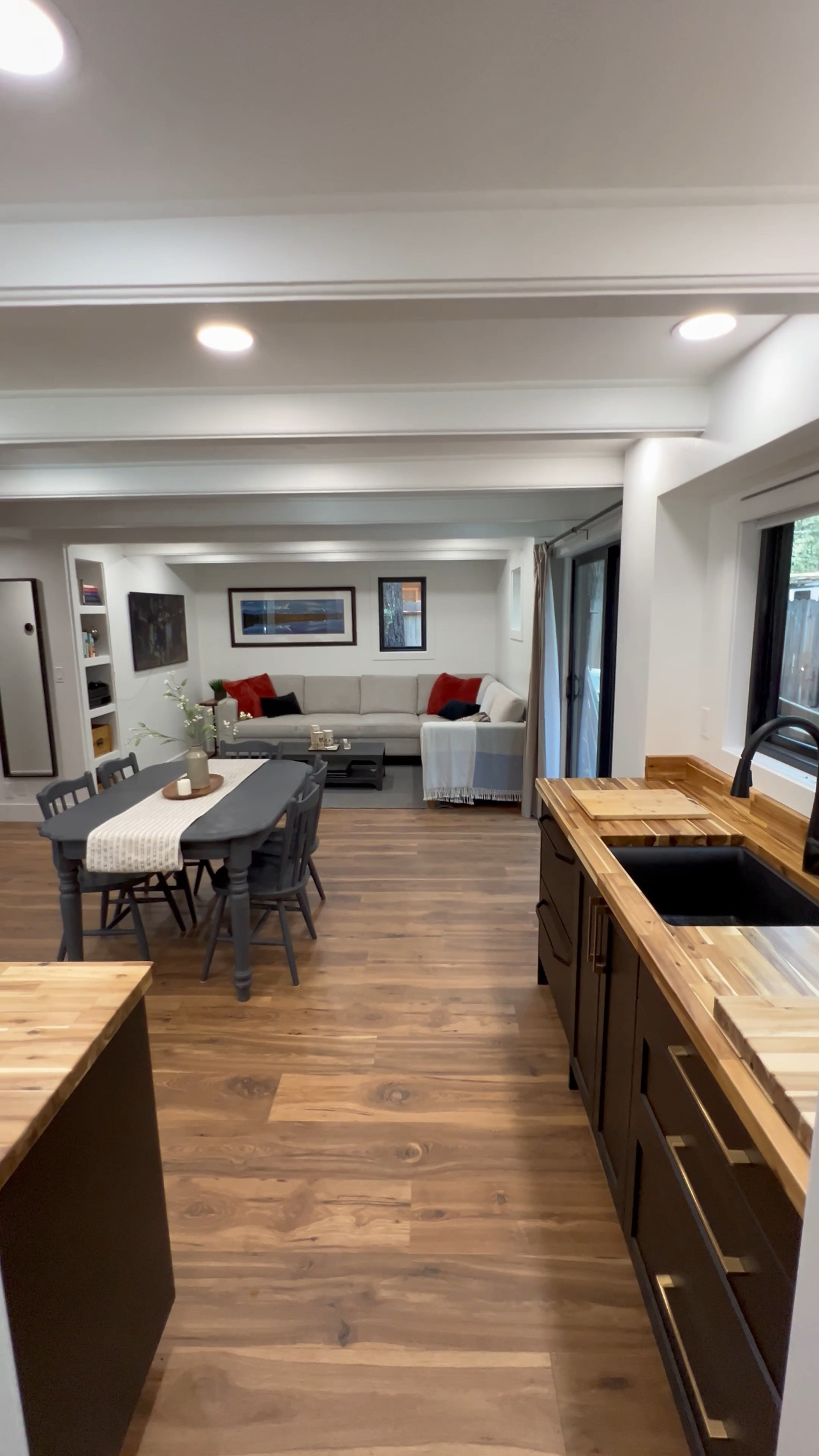 Newly renovated game room with TV and wet bar and beverage fridge