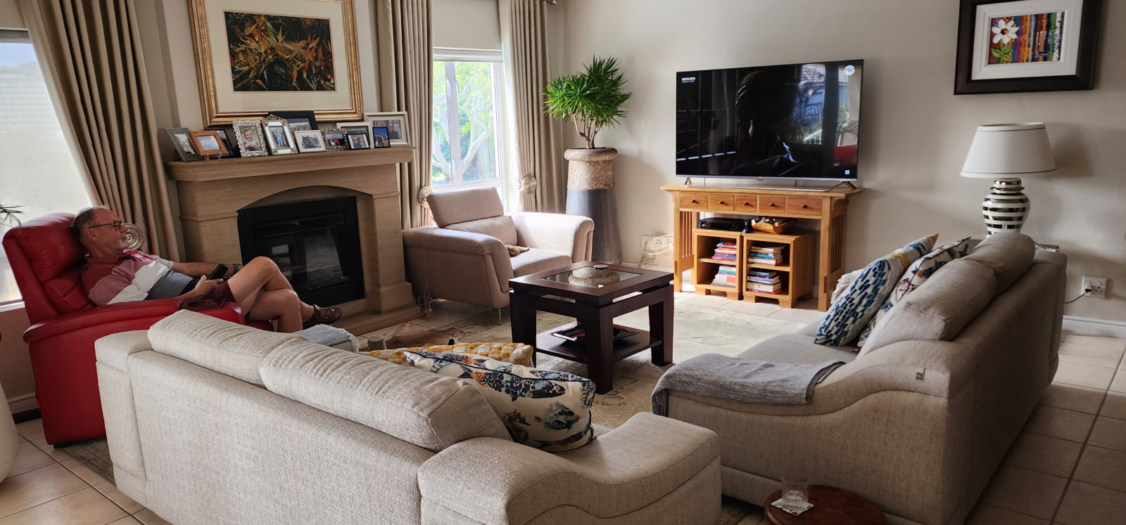 Lounge with lovely fireplace if needed in winter. It has an airconditioner for the hotter summer aft ...