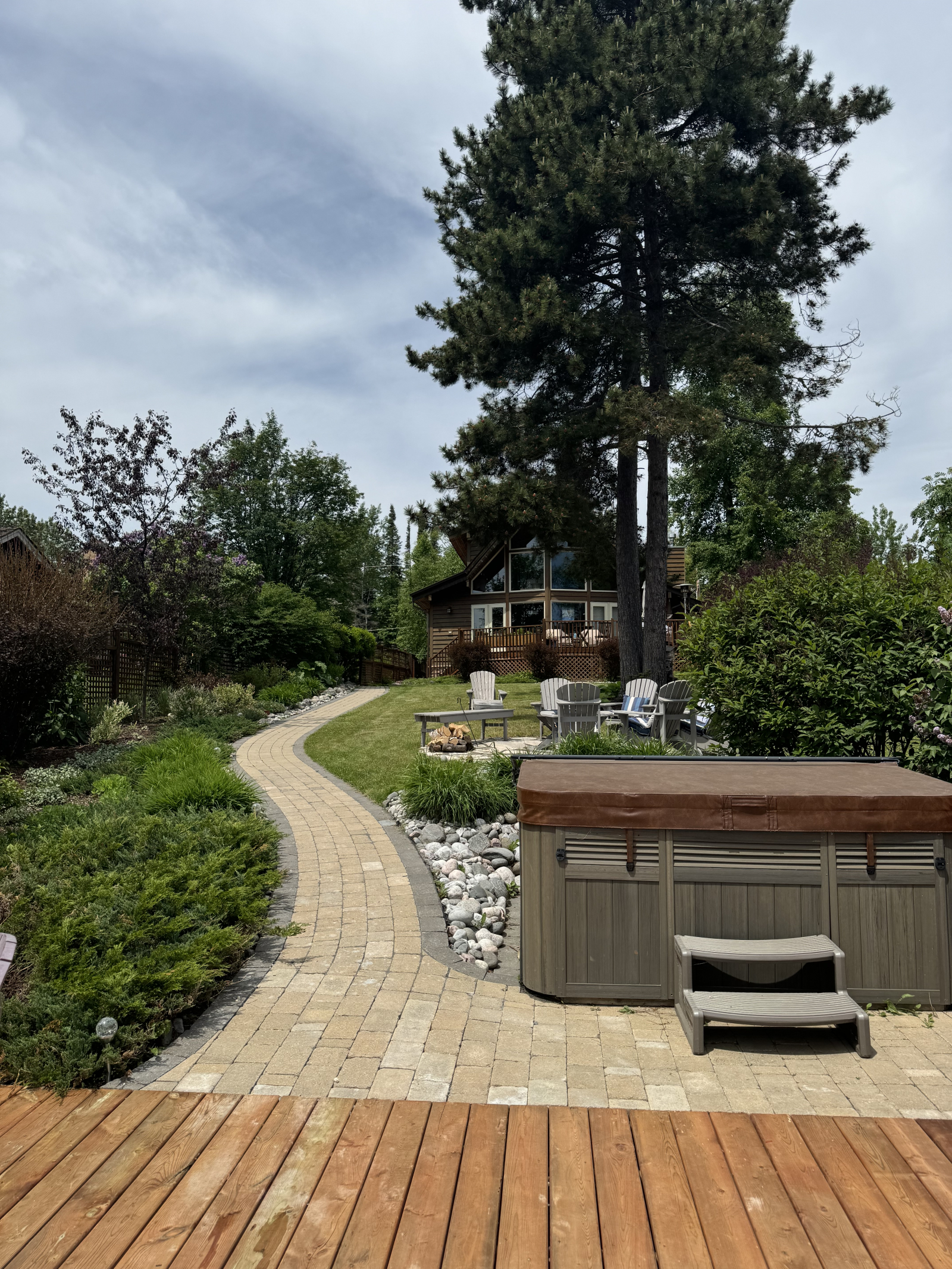 Lakeside deck and hot tub looking towards the house