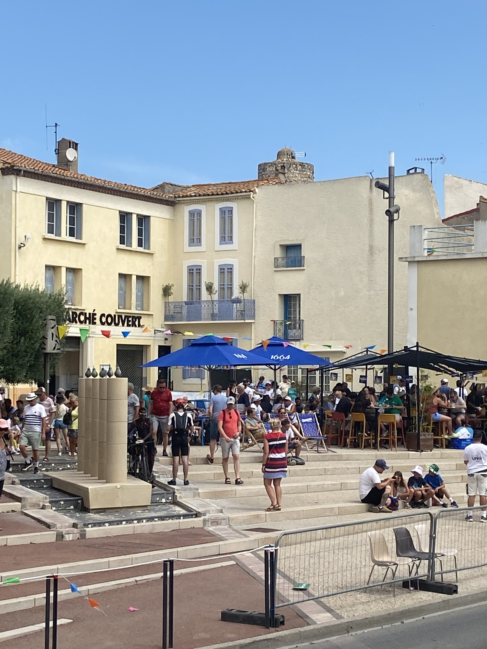 Its the house with the balcony in the corner of the village square.