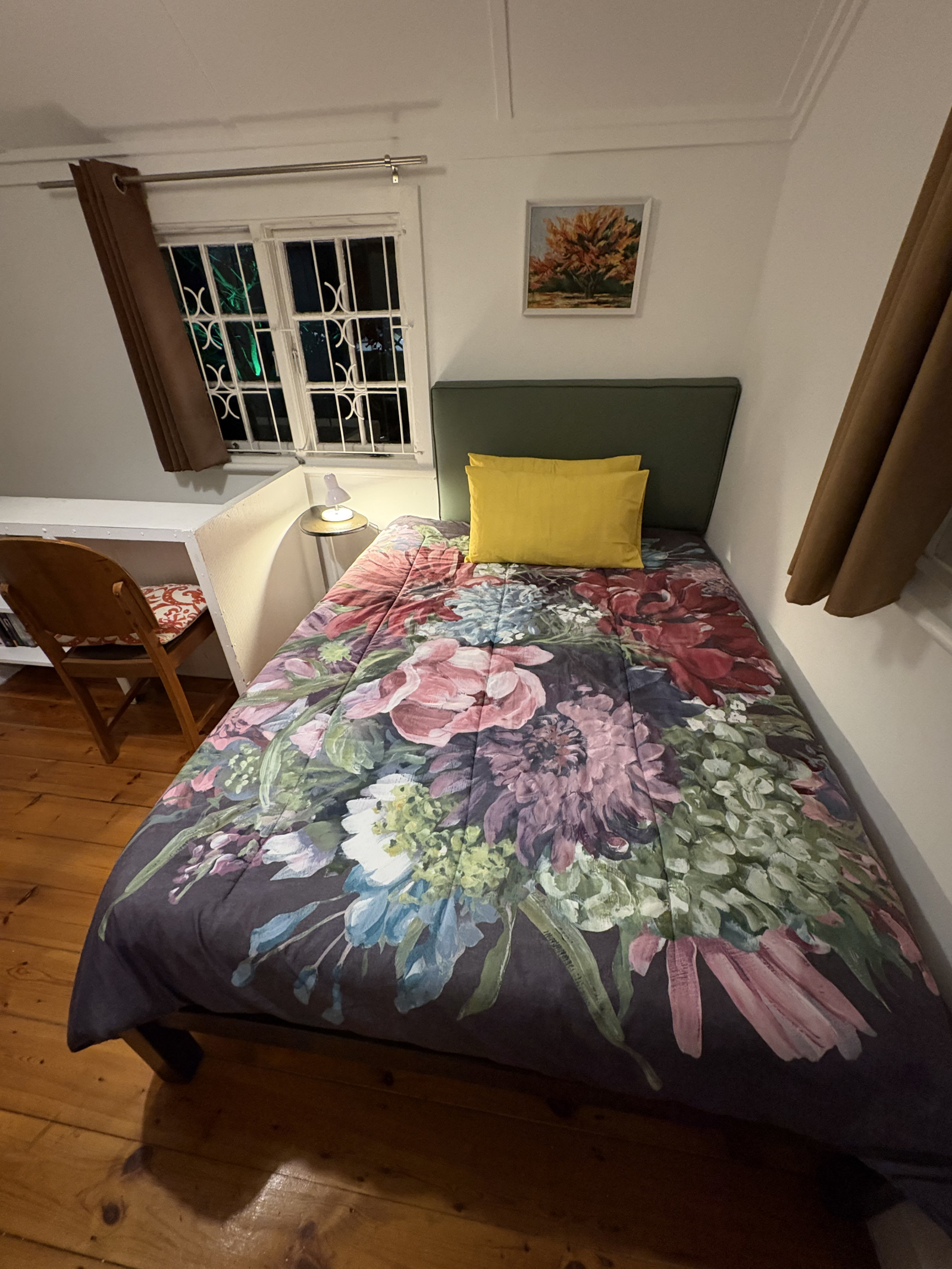 Second bedroom with a double bed - inter leading to the third bedroom in the basement through a smal ...