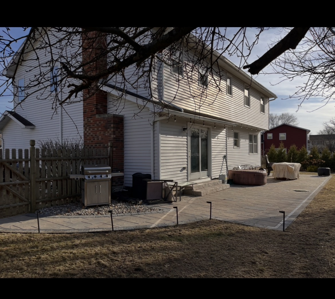 Newly installed patio lines the entire back of the house. Added bonus *a TV has been installed outside by the patio door*
