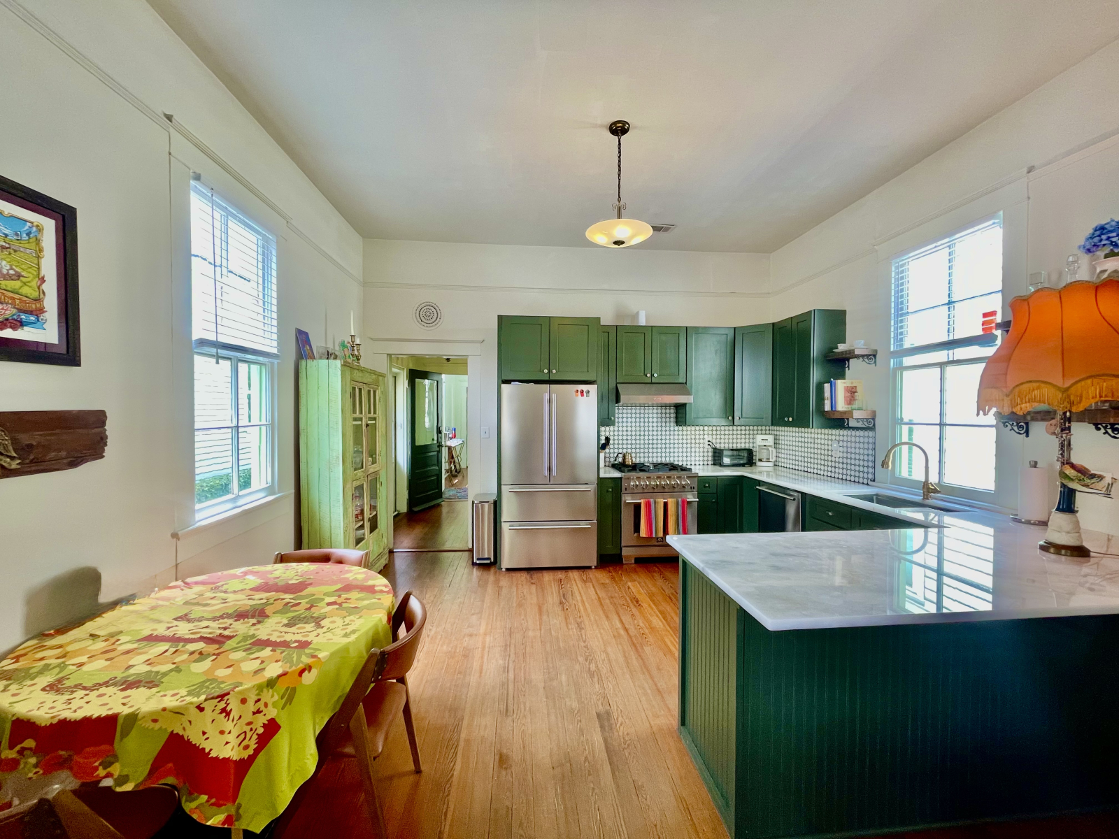 Brand new kitchen installed in 2024 with all new appliances and marble countertops. Nice gathering table for meals when it's too hot or rainy to use the back courtyard table.