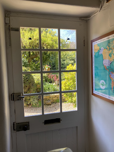 View of the gardens and pond outside the front door