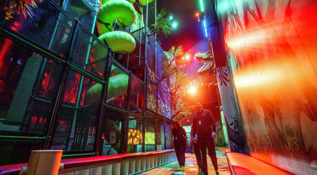 Enormous Dino jungle gym in Dino museum. Need reservations and jump socks.