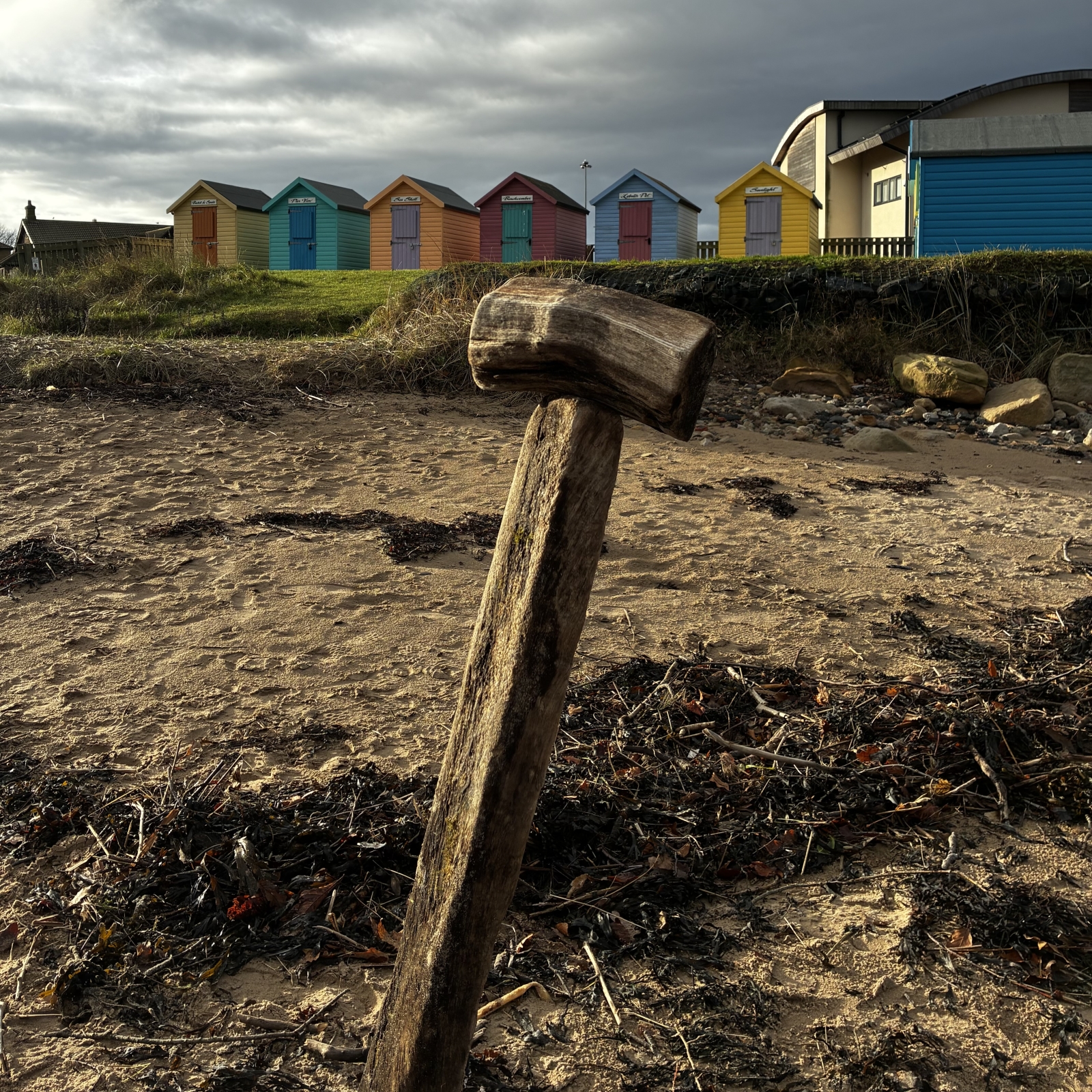 Amble beach huts bring in colour to a moody day