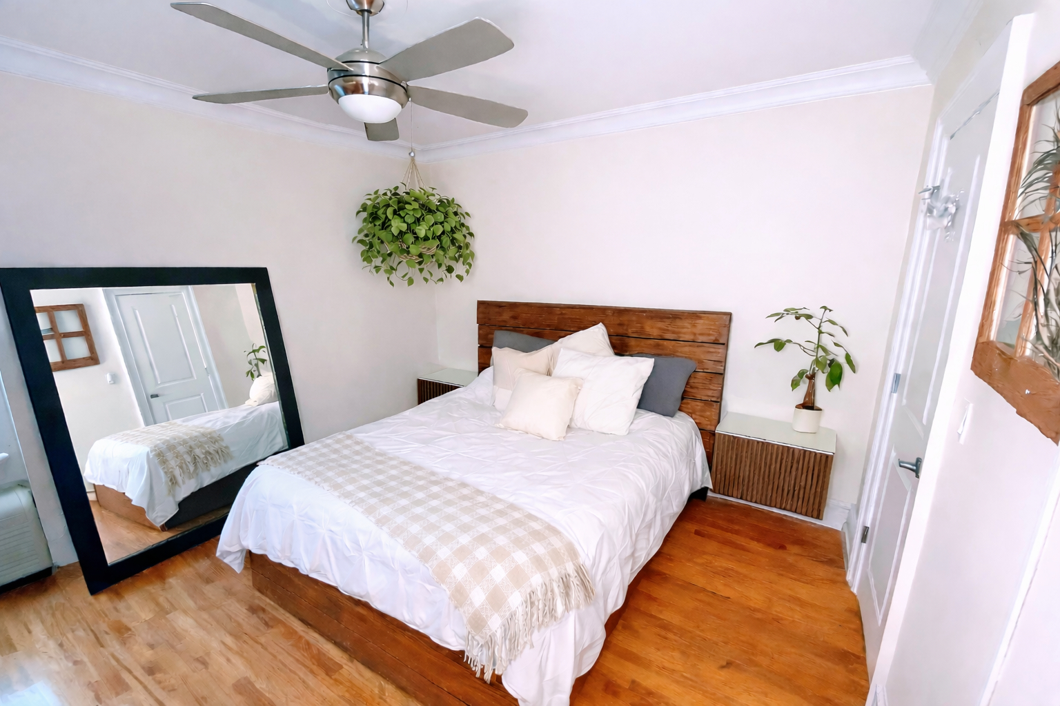 Queen size bed in bedroom. Double layered dark out shades makes room extra dark in the morning.