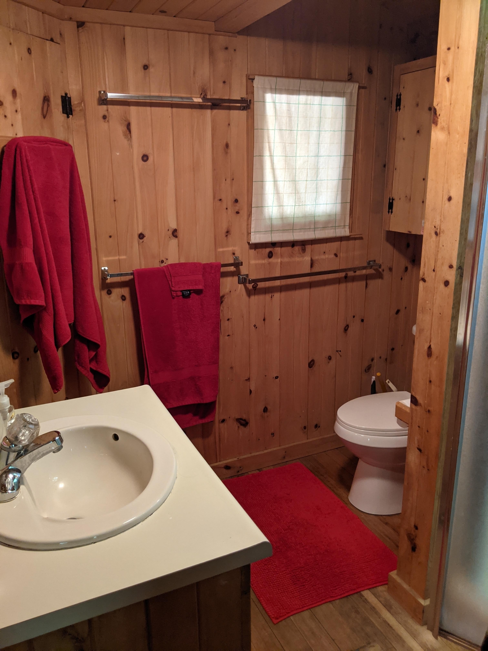 Family cabin at former sleepaway camp with docks, kayaks, and field