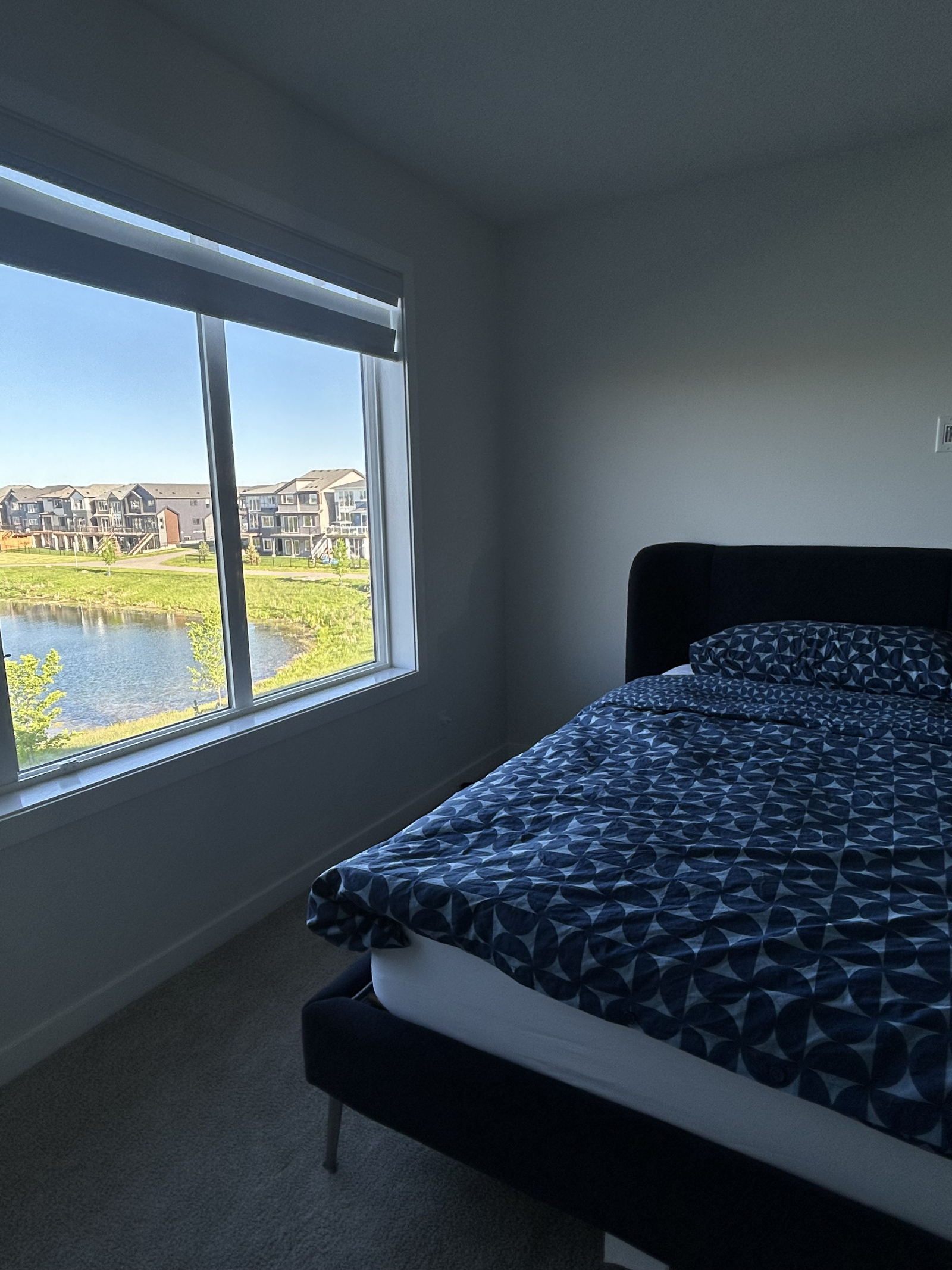 Master bedroom with stunning pond views and a king-size Tempur-Pedic mattress for ultimate comfort