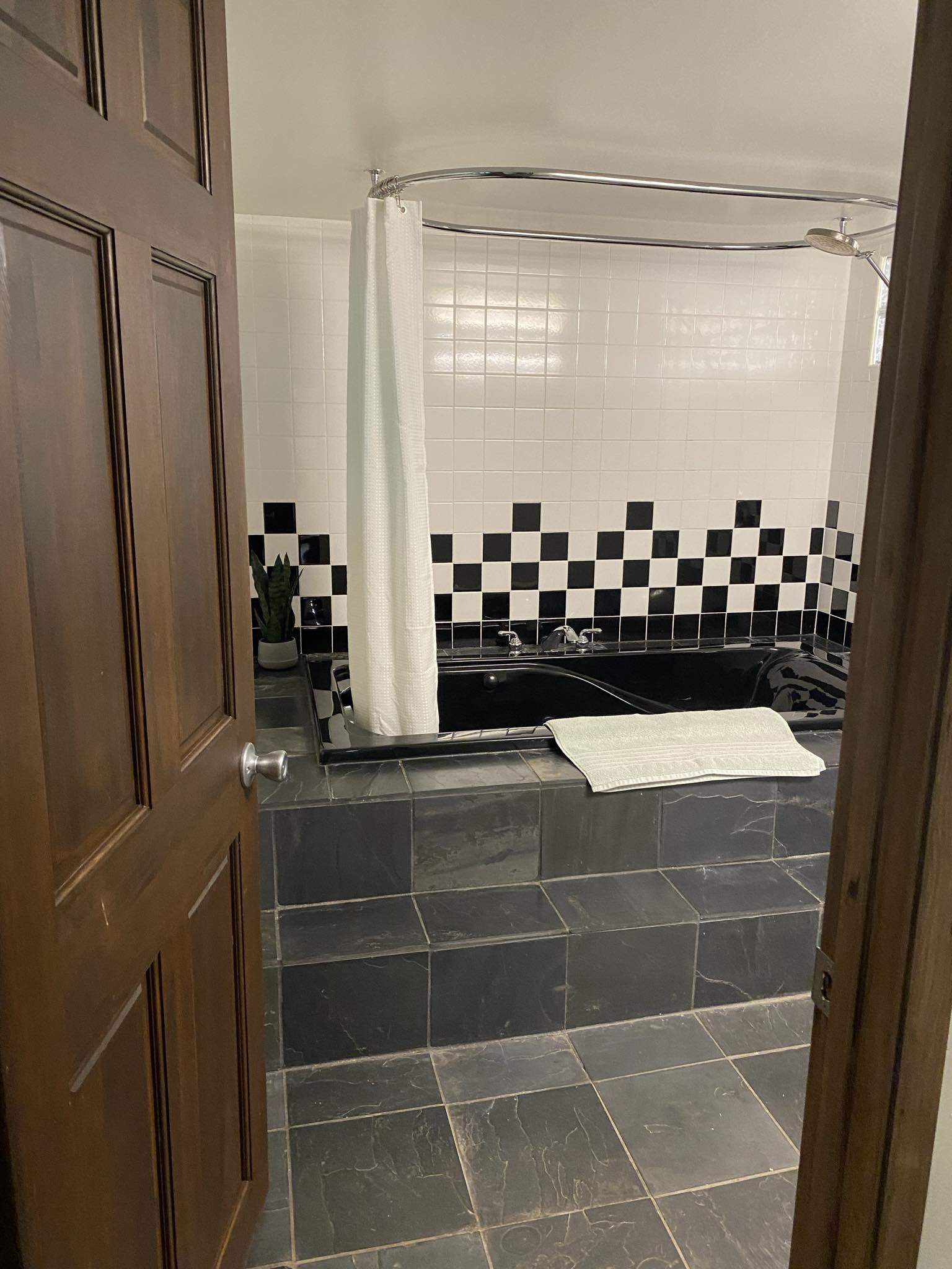 Grotto apartment bathroom with jetted tub