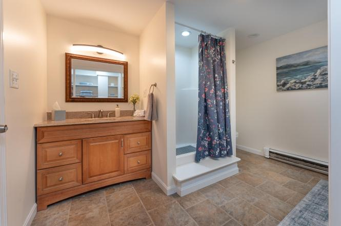 Bath with vanity, shower, toilet, washer and dryer