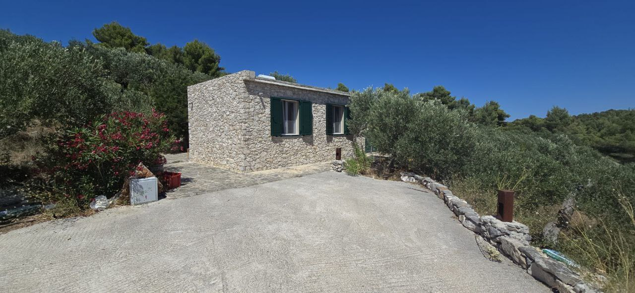 When you arrive on the property, a road will lead you here to the parking lot and entrance to the ho ...