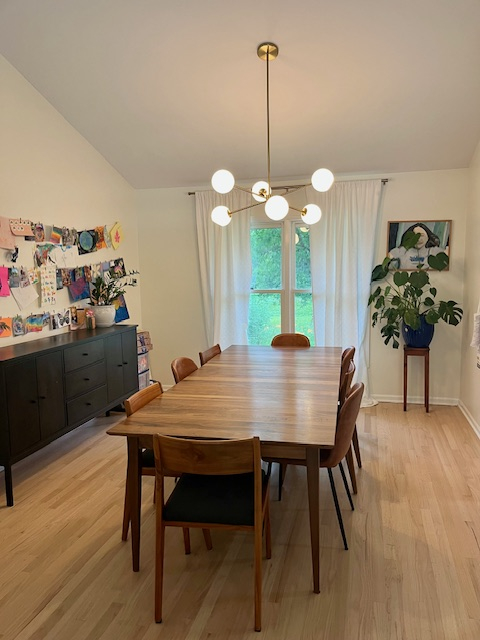 "Formal" dining room - table has two leaves and sits 12 comfortably, black console holds lots of art ...