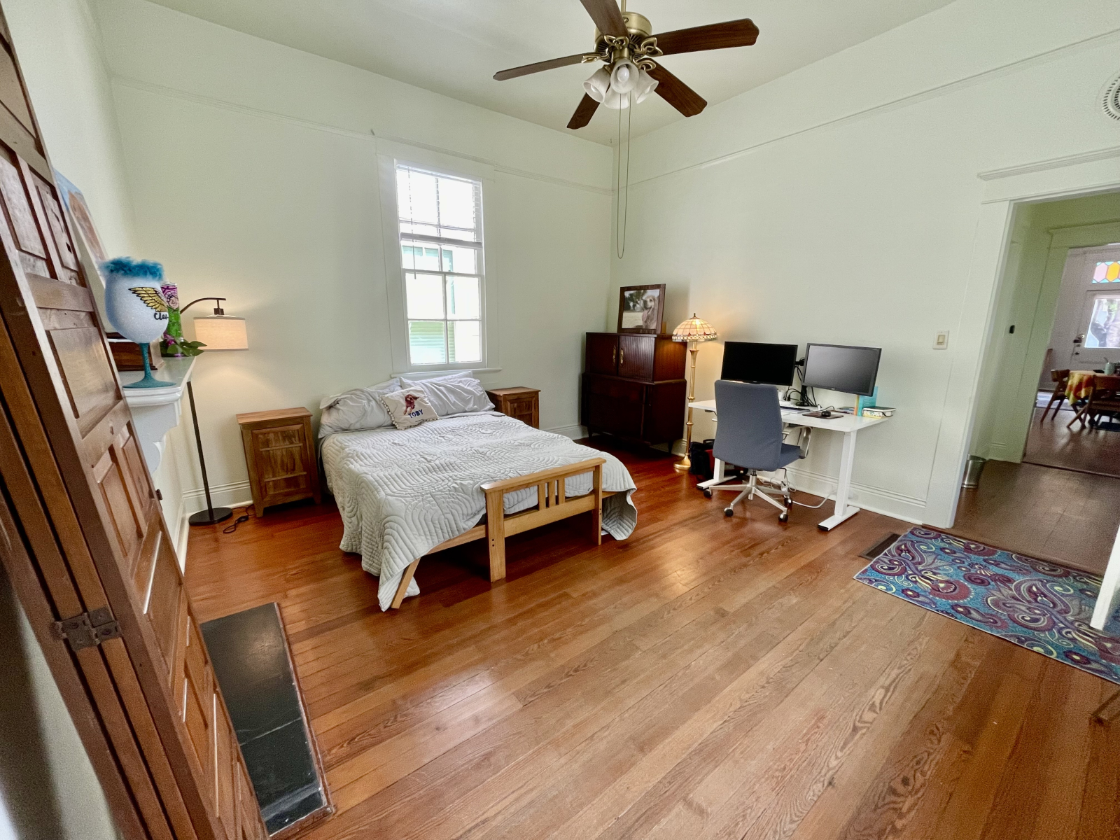 Guest bedroom with a shared office space for remote working.