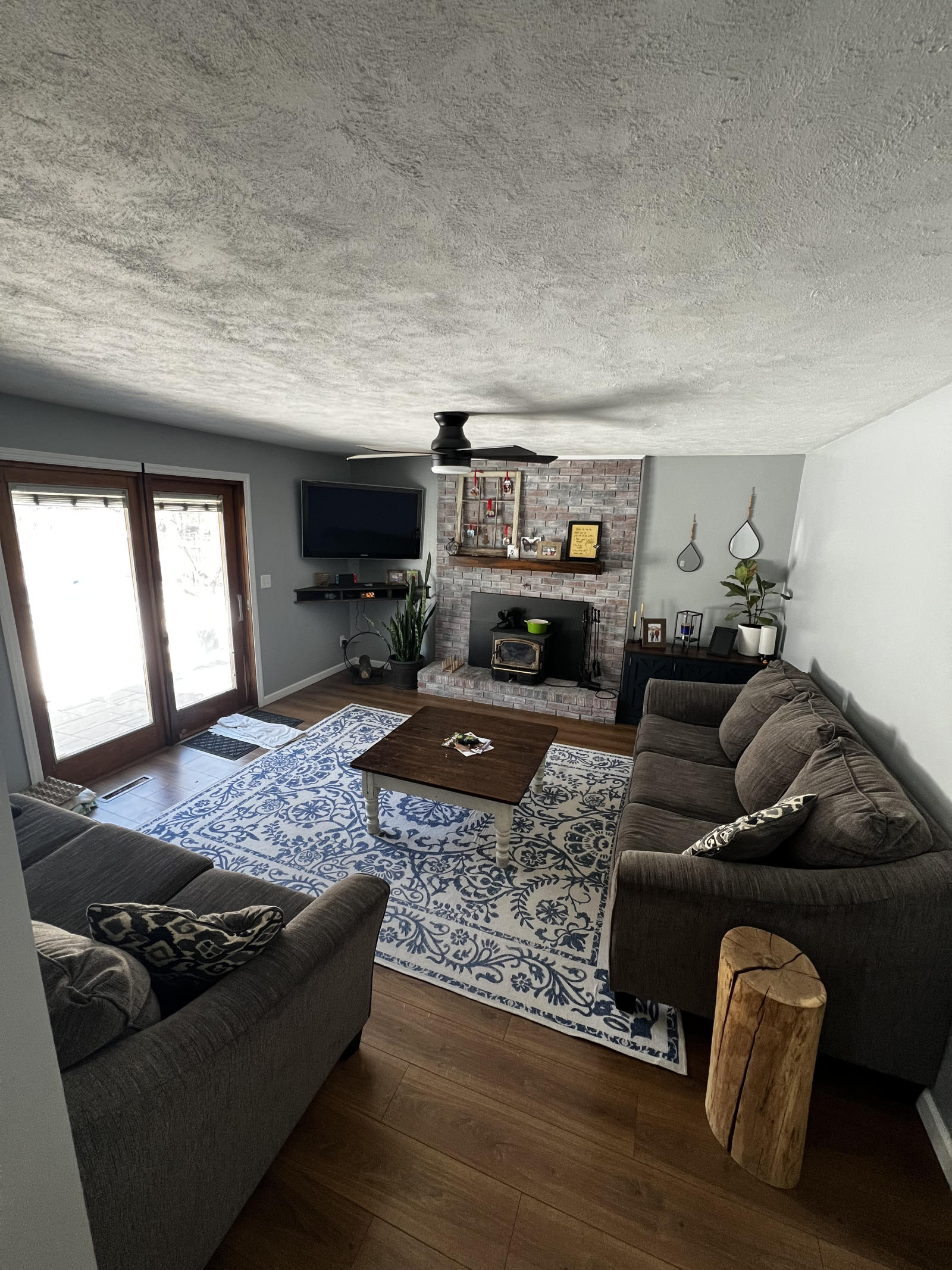 The TV room off the kitchen looks out to the back yard