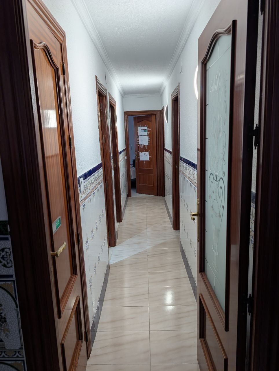 Corridor to bathrooms and bedrooms