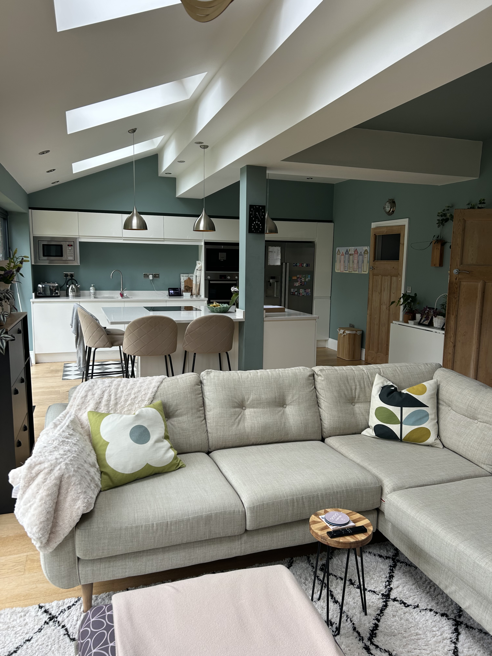Open plan L shaped kitchen diner lounge area