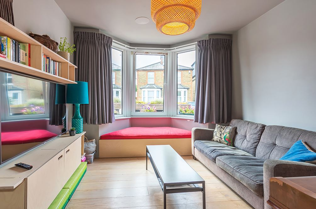 At the front of the house is a lounge room, with sliding door to close it off. The couch converts to ...