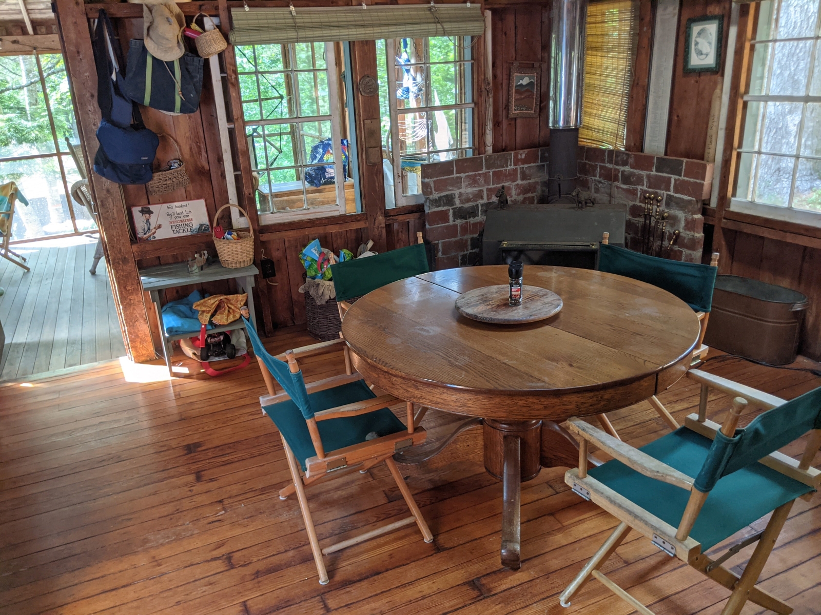 Family cabin at former sleepaway camp with docks, kayaks, and field
